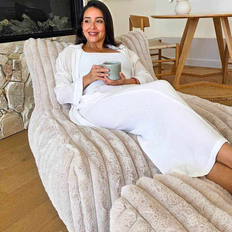 Champagne Brooklyn Luxe Lounger Foam Filled Bean Bag in Corduroy Faux Fur by Mooi Living paired with coordinating ottoman, styled indoors.