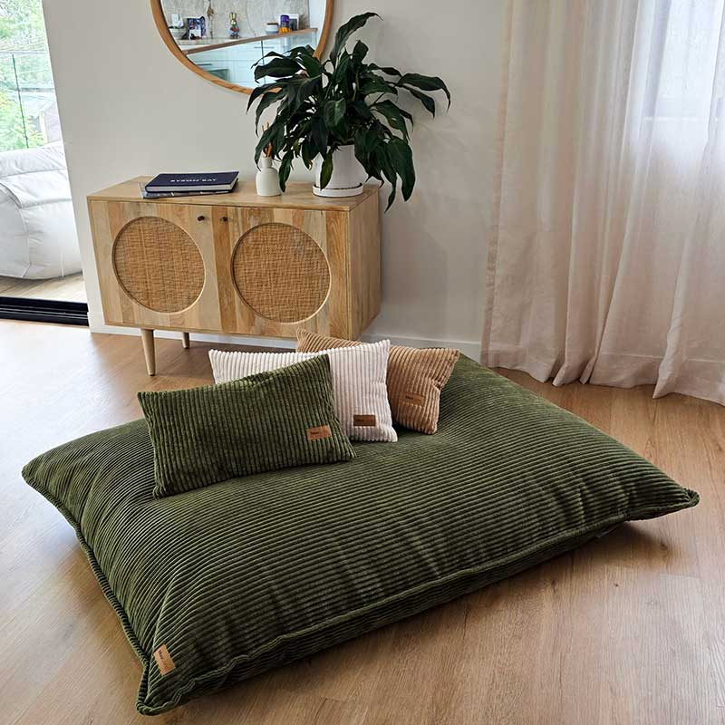 Olive Green, Beige, and Caramel corduroy cushions indoor Bean Bag by Mooi Living, with a Mooi Living brand label on Corduroy Cloud in Olive Green. These cushions are a perfect match to our Cord Chair, Double Cord Lounger, and Corduroy Cloud.