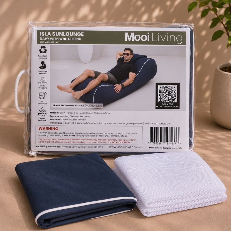 Folded Isla Sunlounger bean bag cover in Navy with white piping and inner bag in a Mooi Living packaging.
