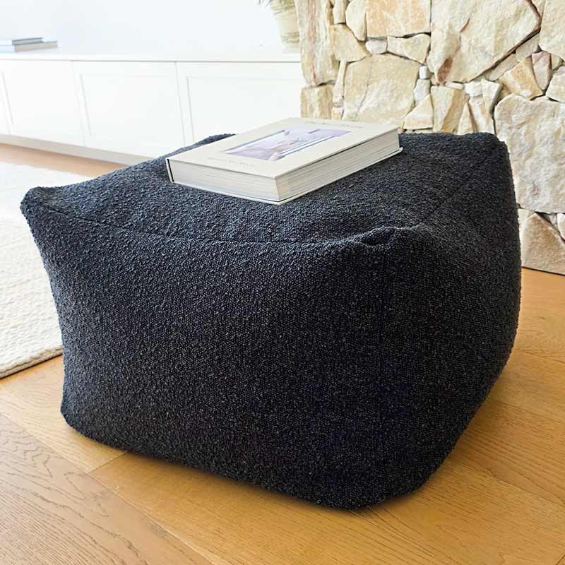 Mooi Living Serena ottoman in Black featuring bouclé upholstery.