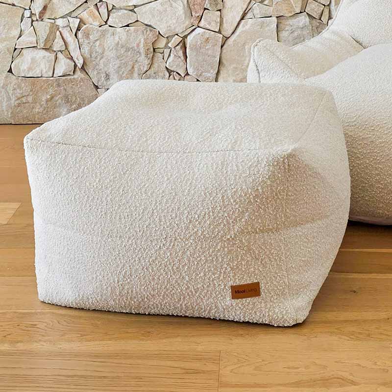 Cream Serena bouclé ottoman designed to pair with the Serena Armchair by Mooi Living.
