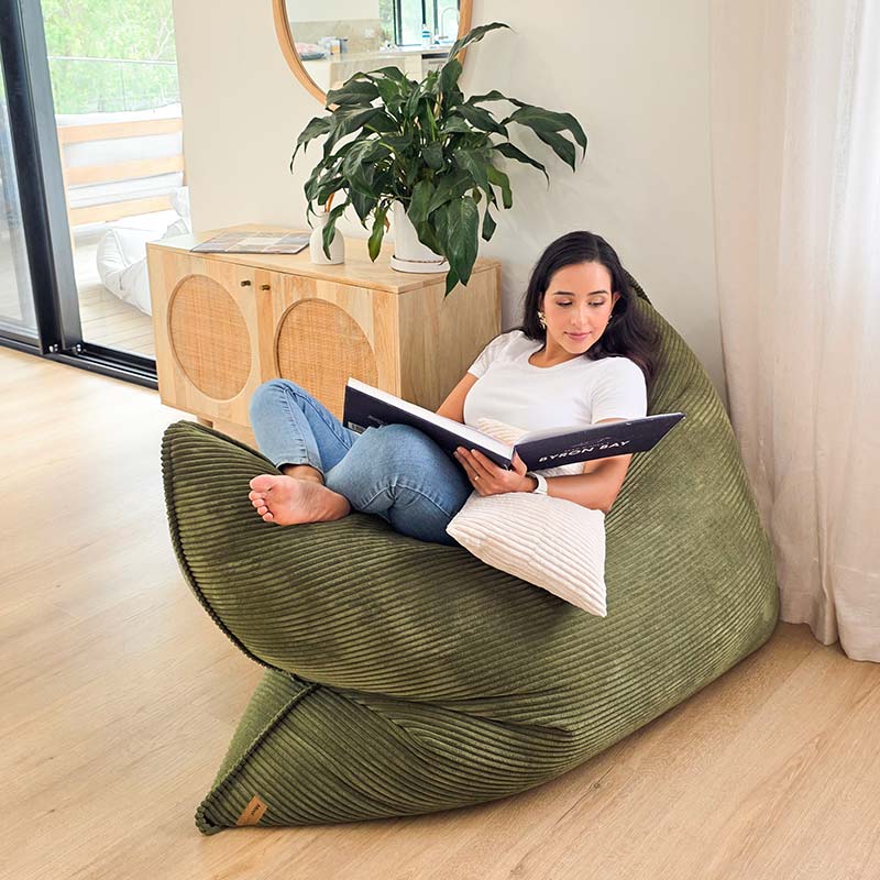Olive green corduroy cloud bean bag mat styled in modern living room