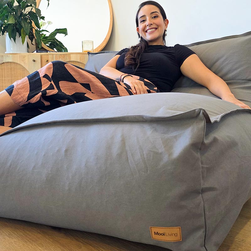 Stylish Mocha Double Boss two person bean bag chair by Mooi Living styled in a neutral interior with adult seated.