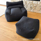 Modern Black Bouclé Serena bean bag chair indoor bean bag by Mooi Living shown with coordinating ottoman.