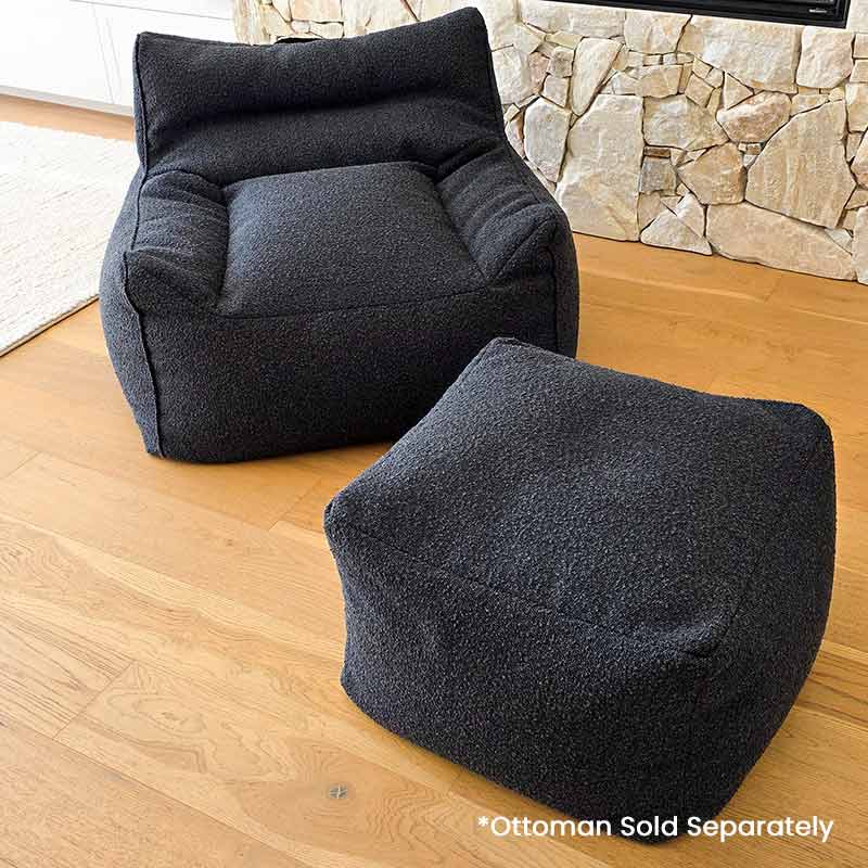 Modern Black Bouclé Serena bean bag chair shown with coordinating ottoman.