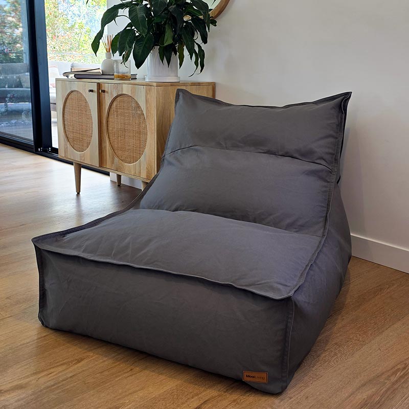 Mocha cotton canvas Single Boss seating by Mooi Living styled against a minimalist wall.