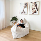 Oversized champagne Cloud Bean Bag mat with woman relaxing and reading indoors