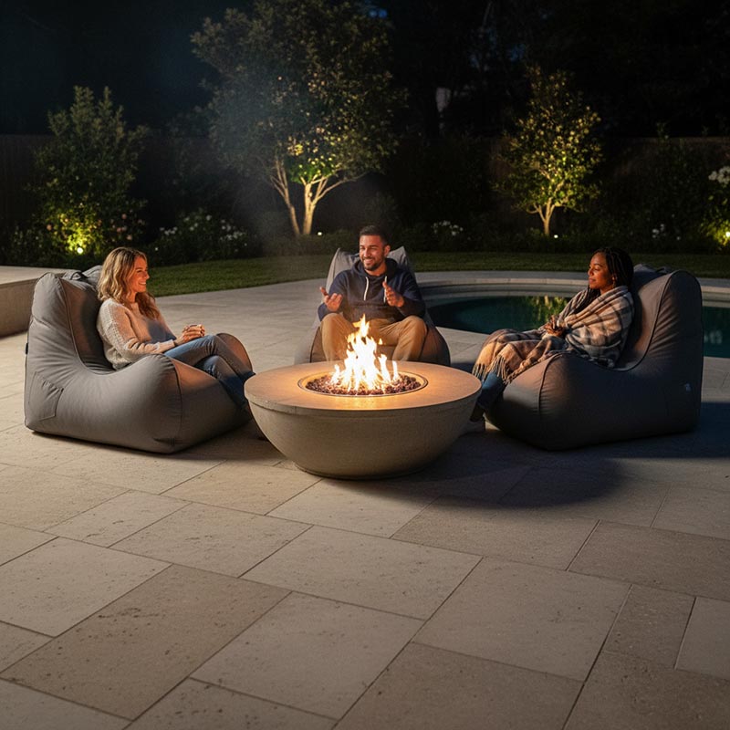 Lifestyle Image - Stone Bora Bora outdoor bean bags around a firepit. Comfortable Outdoor Lounging.