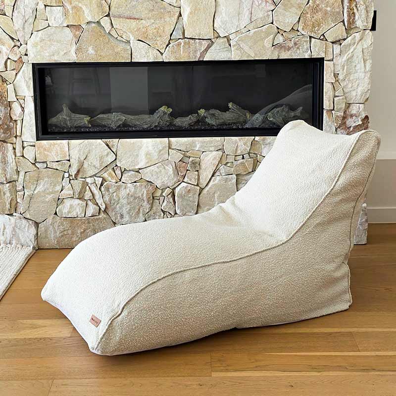 Neutral boucle daybed in a calming interior retreat