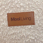 Swatch of Cream Boucle from our Serena Armchair and indoor bean bag by Mooi Living with Mooi Living Logo.