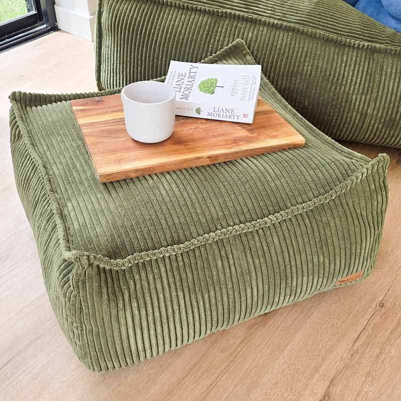 Mooi Cord Ottoman in Olive Green. Plush ribbed corduroy footrest or side table designed to complement the Mooi Cord Bean Bag Chair with stylish function.
