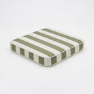 A square outdoor Cushion chair pad stripes of sage green and white, shown at an angle on a white background by Mooi Living, MOO-STR-GRN-CHPAD