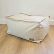 Natural 100% Cotton Canvas Boss Ottoman by Mooi Living placed against a wall in a modern interior.