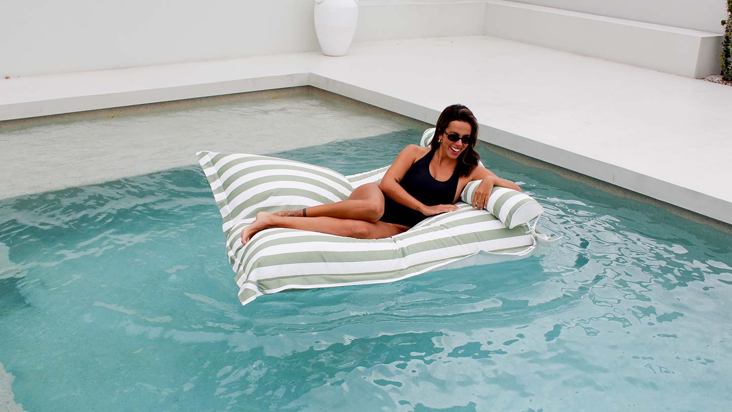 Santorini pool float in sage green stripe – stylish, double seater bean bag for poolside and in-water lounging